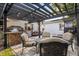 Cozy outdoor patio with ample seating, perfect for entertaining, plus an outdoor kitchen area at 100 Kennison Dr, Orlando, FL 32801