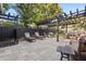 Outdoor patio features a pergola, grill and outdoor kitchen with seating, perfect for entertaining at 100 Kennison Dr, Orlando, FL 32801