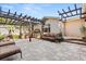 Spacious outdoor patio features a built-in grill, pergola, seating area, and ample room for entertaining at 100 Kennison Dr, Orlando, FL 32801