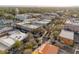 Aerial view of the city streets with buildings, trees, and cars on a sunny day in the district at 101 W Oakland Ave, Oakland, FL 34760