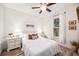 Cozy bedroom with neutral tones, plush bedding, and ample natural light at 101 W Oakland Ave, Oakland, FL 34760