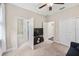 Bedroom view includes a TV, access to an ensuite bathroom, and closet space at 101 W Oakland Ave, Oakland, FL 34760