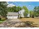 This property has a three-car garage and lush landscaping at 101 W Oakland Ave, Oakland, FL 34760