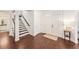 An interior view of the home's foyer and hardwood floors, featuring a staircase at 101 W Oakland Ave, Oakland, FL 34760