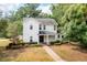 Charming two-story home with a well-maintained front yard and a brick pathway at 101 W Oakland Ave, Oakland, FL 34760