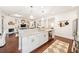 Bright, open-concept kitchen with an adjacent living space and ample counter space at 101 W Oakland Ave, Oakland, FL 34760