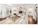 The living room has built-in bookshelves, a fireplace, and French doors at 101 W Oakland Ave, Oakland, FL 34760