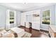 Home office featuring custom built-ins, natural light, and modern decor at 101 W Oakland Ave, Oakland, FL 34760