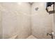 Tile shower with a built-in seat and decorative trim at 101 W Oakland Ave, Oakland, FL 34760