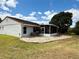 An inviting screened-in lanai with a brick patio extends the living space to the lush outdoors at 10125 Matchlock Dr, Orlando, FL 32821