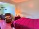 Inviting bedroom with a cozy recliner, soft lighting, and warm-toned accents at 10125 Matchlock Dr, Orlando, FL 32821