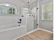 Bright bathroom with a soaking tub and glass-enclosed shower at 1024 Destin Dr, Lake Wales, FL 33898