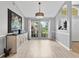 Dining room featuring light gray walls, wood-look flooring, and bright, large windows at 1024 Destin Dr, Lake Wales, FL 33898