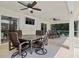 Covered lanai with ceiling fans offers a perfect outdoor dining and seating area at 1024 Destin Dr, Lake Wales, FL 33898