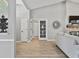 Open-concept living room with vaulted ceilings, wood-look floors, and modern decor at 1024 Destin Dr, Lake Wales, FL 33898