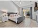Spacious main bedroom with vaulted ceilings, fireplace, and private patio access at 1024 Destin Dr, Lake Wales, FL 33898