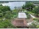 Aerial view of a lakefront recreational area including sports fields, volleyball court, and clubhouse at 103 Greenleaf Ln, Altamonte Springs, FL 32714