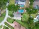 An aerial view of a beautiful landscaped home with a pool and backyard patio at 103 Greenleaf Ln, Altamonte Springs, FL 32714