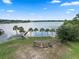 Aerial shot showcases lake with a fishing dock, picnic benches, and a gazebo in a lakeside community at 103 Greenleaf Ln, Altamonte Springs, FL 32714