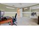 Office space includes a light green wall with a window and a dark wooden desk at 103 Greenleaf Ln, Altamonte Springs, FL 32714