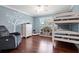 Bedroom featuring a bunkbed, wood floors, and decorated with a large tree graphic at 103 Greenleaf Ln, Altamonte Springs, FL 32714