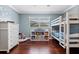 Bright bedroom features a white bunk bed, hardwood floors, and ample natural light at 103 Greenleaf Ln, Altamonte Springs, FL 32714