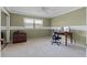 Office space includes a light green wall with a window and a dark wooden desk at 103 Greenleaf Ln, Altamonte Springs, FL 32714