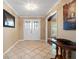 Inviting foyer with tile flooring, a double door entryway, and seamless transition to the rest of the house at 103 Greenleaf Ln, Altamonte Springs, FL 32714