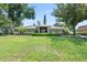 Beautiful single-story house with stone accents, manicured lawn, and lush landscaping, showcasing great curb appeal at 103 Greenleaf Ln, Altamonte Springs, FL 32714