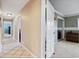 Hallway leading to a bedroom with carpeted floors and sliding closet doors at 103 Greenleaf Ln, Altamonte Springs, FL 32714