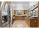 Modern kitchen with stainless steel appliances, tile floors, and a center island with granite countertops at 103 Greenleaf Ln, Altamonte Springs, FL 32714