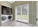 Bright laundry room with modern washer and dryer units and lots of natural light at 103 Greenleaf Ln, Altamonte Springs, FL 32714