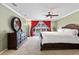A spacious main bedroom with neutral carpet, ceiling fan, and sliding glass doors overlooking the pool at 103 Greenleaf Ln, Altamonte Springs, FL 32714