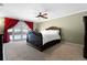 A spacious main bedroom with neutral carpet, ceiling fan, and sliding glass doors to the pool area at 103 Greenleaf Ln, Altamonte Springs, FL 32714