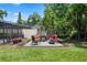 Outdoor seating area with paving stones overlooking the lawn and trees at 103 Greenleaf Ln, Altamonte Springs, FL 32714