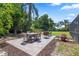 Outdoor seating area with paving stones overlooking the lawn and trees at 103 Greenleaf Ln, Altamonte Springs, FL 32714