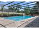 Sparkling pool surrounded by a screened enclosure and brick patio at 103 Greenleaf Ln, Altamonte Springs, FL 32714