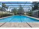 Large enclosed pool with brick pavers, lounge chairs, and a well-maintained fence at 103 Greenleaf Ln, Altamonte Springs, FL 32714