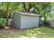 Backyard storage shed with white trim at 103 Greenleaf Ln, Altamonte Springs, FL 32714