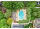 Aerial view of the community pool, amenities, and lush landscaping providing a serene environment at 1062 Winglewood, Altamonte Springs, FL 32714