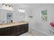 Bathroom featuring a double vanity, soaking tub, and granite countertops at 1062 Winglewood, Altamonte Springs, FL 32714