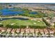 An aerial view showcasing the property's location near a golf course, lakes, and a well-planned community at 1082 Trappers Trail Loop, Davenport, FL 33896