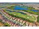 Aerial view of community with golf course, lakes and homes at 1082 Trappers Trail Loop, Davenport, FL 33896