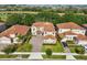 Aerial view of a two-story home with well-manicured landscaping at 1082 Trappers Trail Loop, Davenport, FL 33896