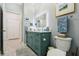 Bathroom featuring a vanity with a white countertop and LED mirror at 1082 Trappers Trail Loop, Davenport, FL 33896