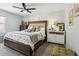 Comfortable bedroom features a king size bed, soft carpet, and natural lighting at 1082 Trappers Trail Loop, Davenport, FL 33896