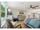 Comfortable bedroom featuring a ceiling fan, a large window and an art-deco dresser at 1082 Trappers Trail Loop, Davenport, FL 33896