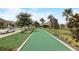 Community bocce ball court surrounded by lush landscaping, for outdoor recreation at 1082 Trappers Trail Loop, Davenport, FL 33896