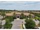Beautiful clubhouse with a tile roof, surrounded by palm trees and well-kept landscaping at 1082 Trappers Trail Loop, Davenport, FL 33896