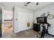 Well-organized exercise room with carpet, and a small refrigerator at 1082 Trappers Trail Loop, Davenport, FL 33896